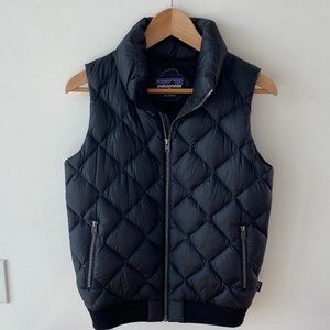 Black, quilted goose down Patagonia vest with knit ribbing. Size Small